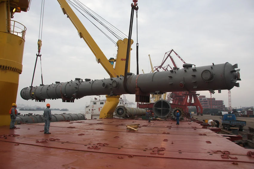 Long industrial equipment being lifted over the vessel’s deck.